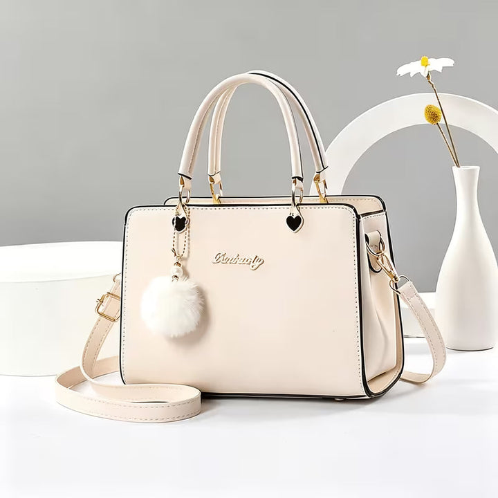 Sanika - Sac à Main Avec Breloque Pompon et Bandoulière