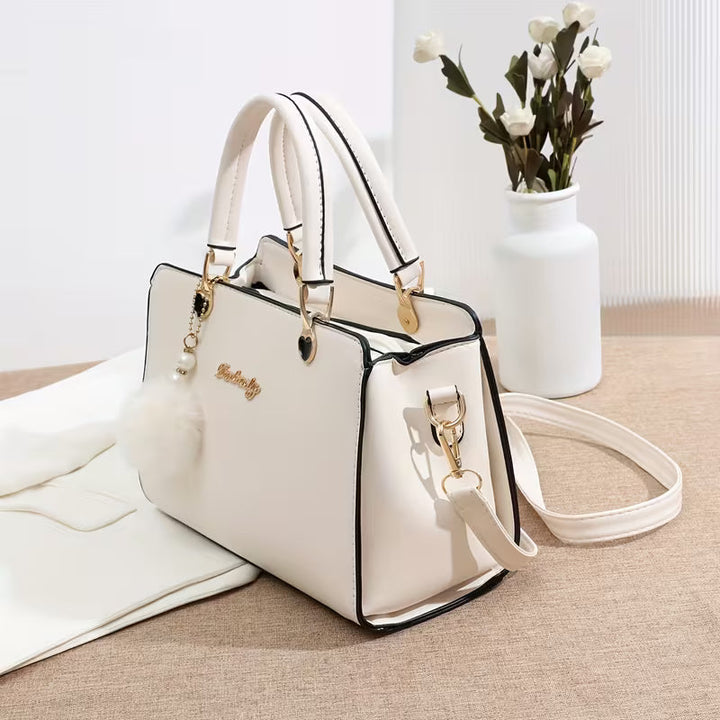 Sanika - Sac à Main Avec Breloque Pompon et Bandoulière