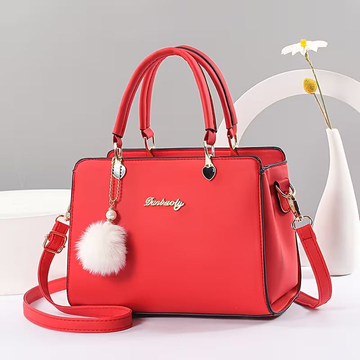 Sanika - Sac à Main Avec Breloque Pompon et Bandoulière